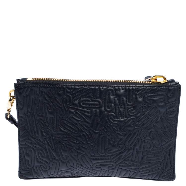 Pre Owned Moschino Black Logo Embossed Leather Wristlet Clutch