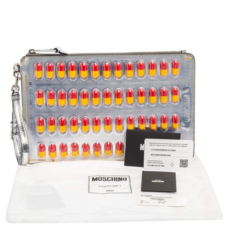 Pre Owned Moschino Silver Leather And PVC Pill Blister Wristlet Clutch