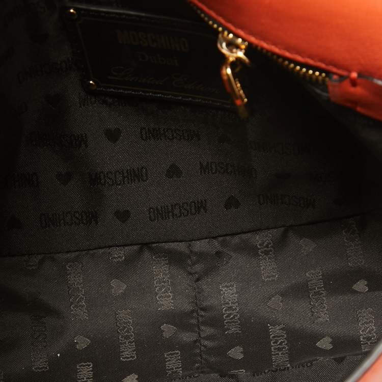 Pre Owned Moschino Orange Leather Limited Edition Logo Flap Crossbody Bag