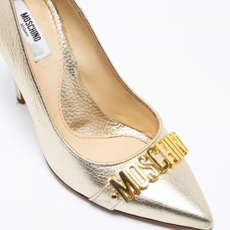 Pre Owned Moschino Metallic Gold Leather Logo Embellished Pointed Toe Pumps Size 36