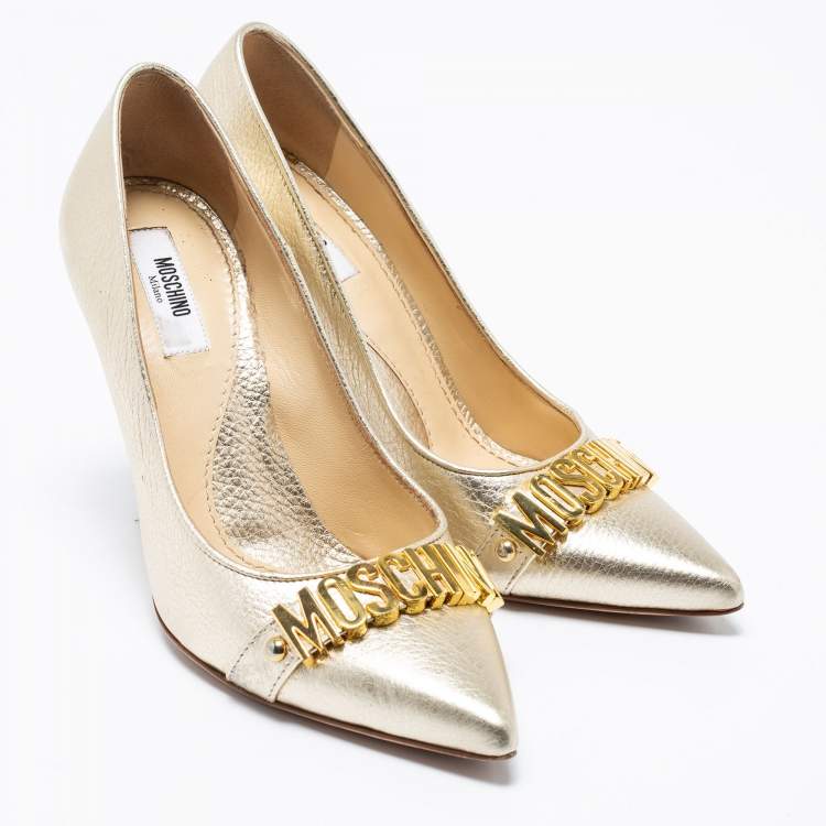 Pre Owned Moschino Metallic Gold Leather Logo Embellished Pointed Toe Pumps Size 36