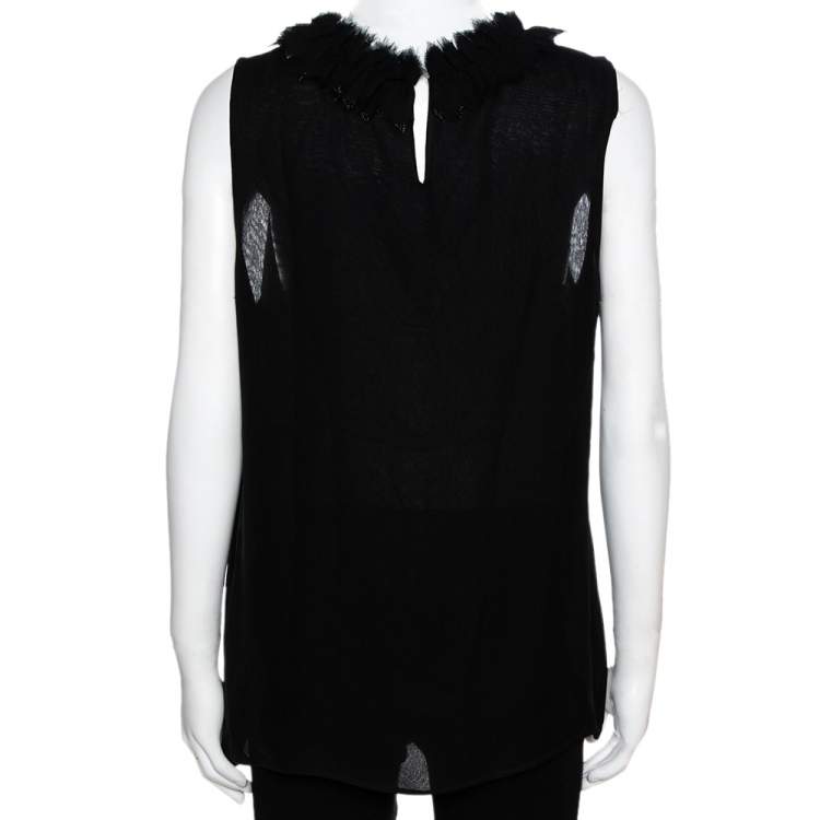 black sleeveless ruffle blouse