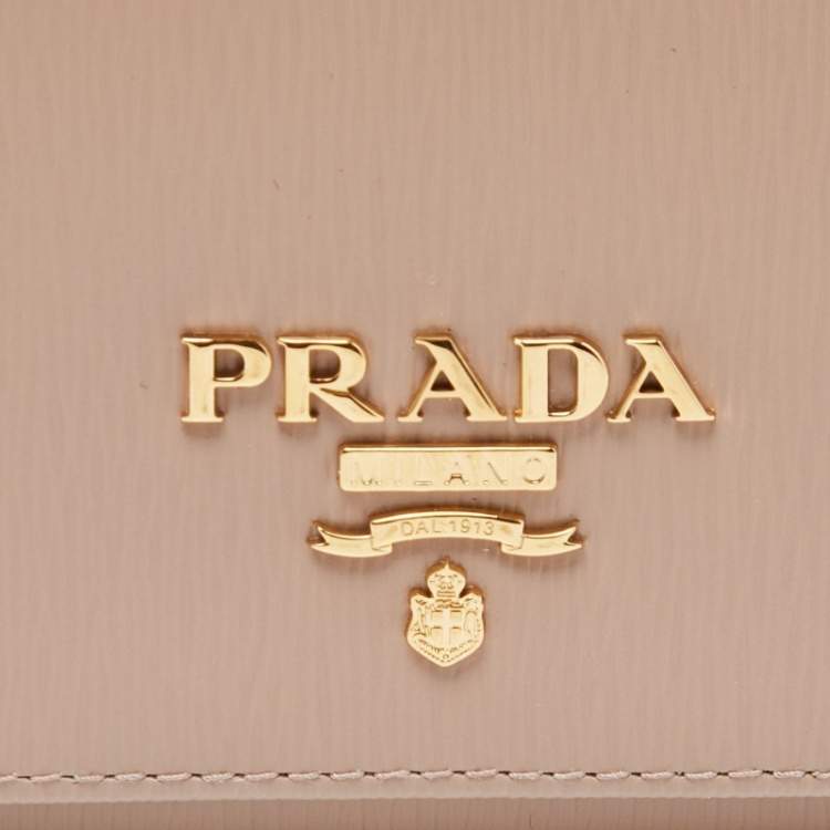 Pre Owned Prada Beige Vitello Metal Leather Logo Trifold Wallet