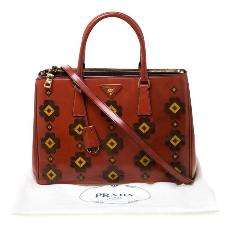 Pre Owned Prada Dark Orange Floral Applique Leather Medium Double Zip Tote