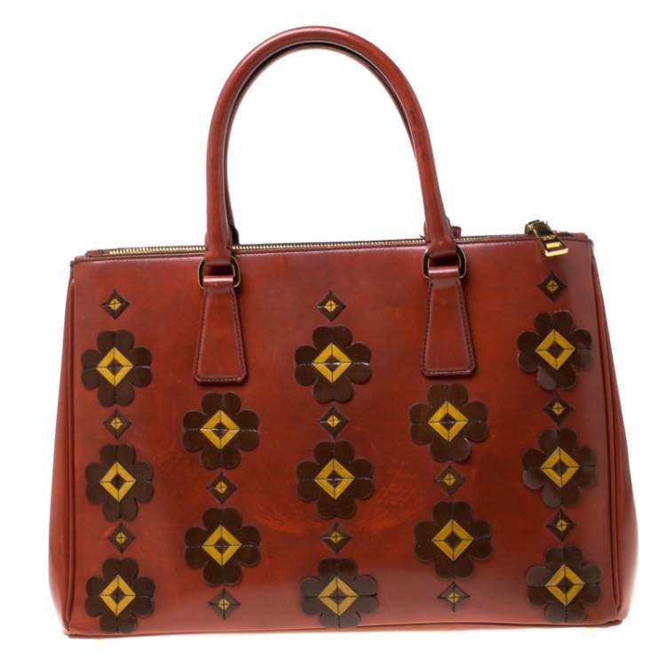 Pre Owned Prada Dark Orange Floral Applique Leather Medium Double Zip Tote