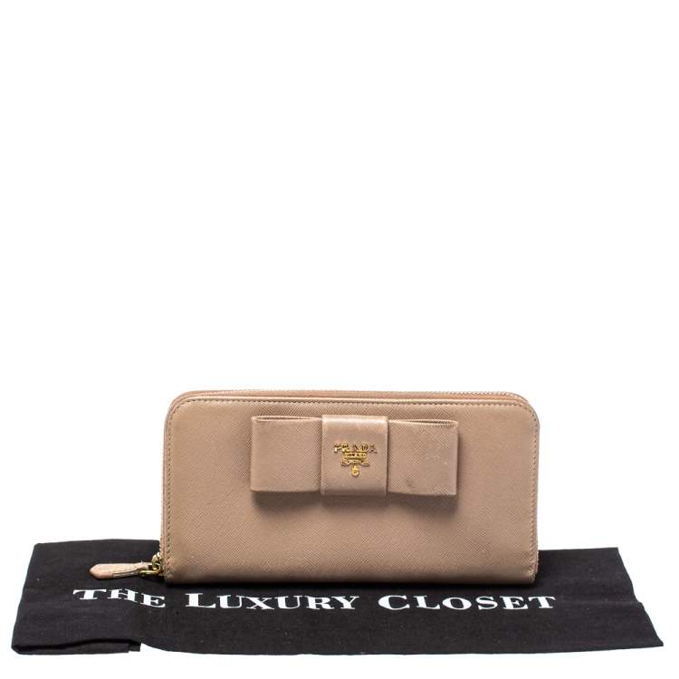 Pre Owned Prada Beige Saffiano Leather Bow Zip Around Wallet
