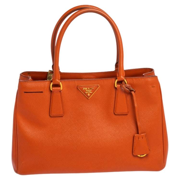 Prada best sale orange clutch