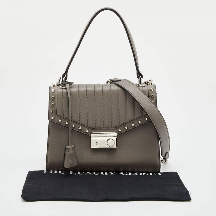 Pre Owned Prada Grey Glace Leather Studded Sound Top Handle Bag
