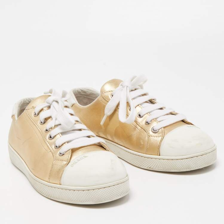 Pre Owned Prada Gold/White Leather and Rubber Low Top Sneakers Size 38