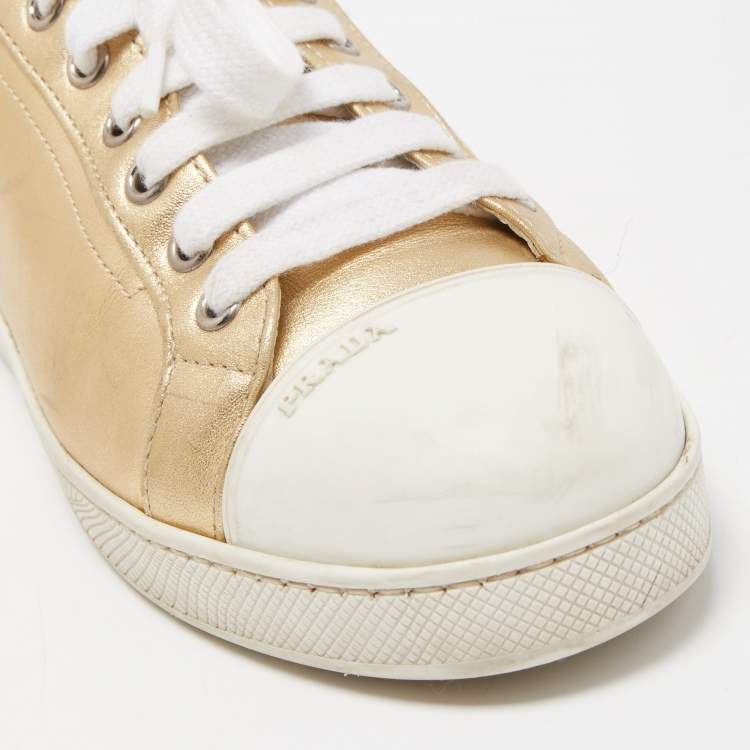 Pre Owned Prada Gold/White Leather and Rubber Low Top Sneakers Size 38
