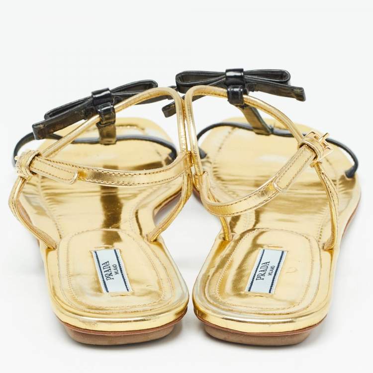 Pre Owned Prada Gold/Black Patent Leather Bow T Strap Flats Size 38.5  