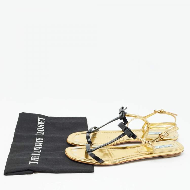 Pre Owned Prada Gold/Black Patent Leather Bow T Strap Flats Size 38.5  