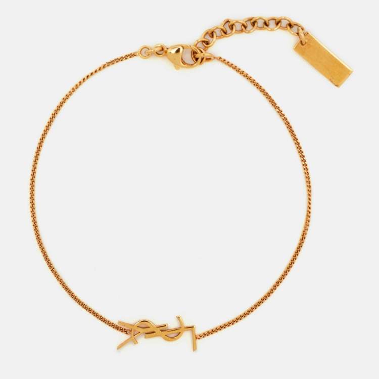 Pre Owned Saint Laurent Paris Cassandre Charm Gold Tone Bracelet