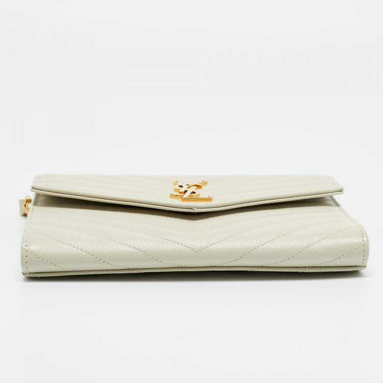 Pre Owned Saint Laurent Off White Matelasse Leather Cassandre Wristlet Clutch