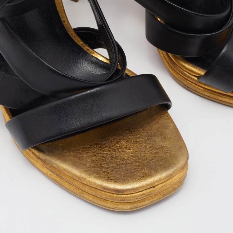 مملوكة مسبقًا Saint Laurent Black/Gold Leather  Ankle Wrap Sandals Size 37.5