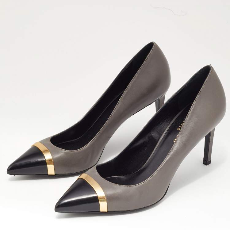 Pair of gray pointed-toe platform pumps with silver studs, Court