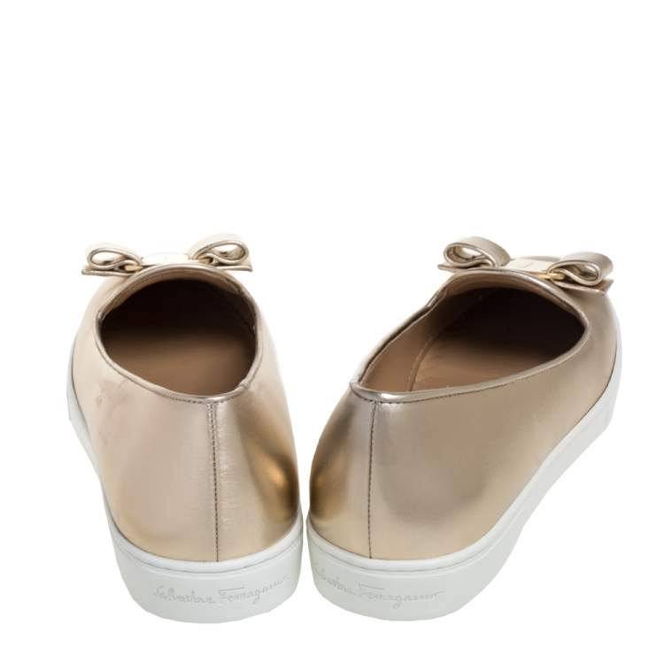 Pre Owned Salvatore Ferragamo Gold Leather Novello Bow Slip On Sneakers Size 36.5