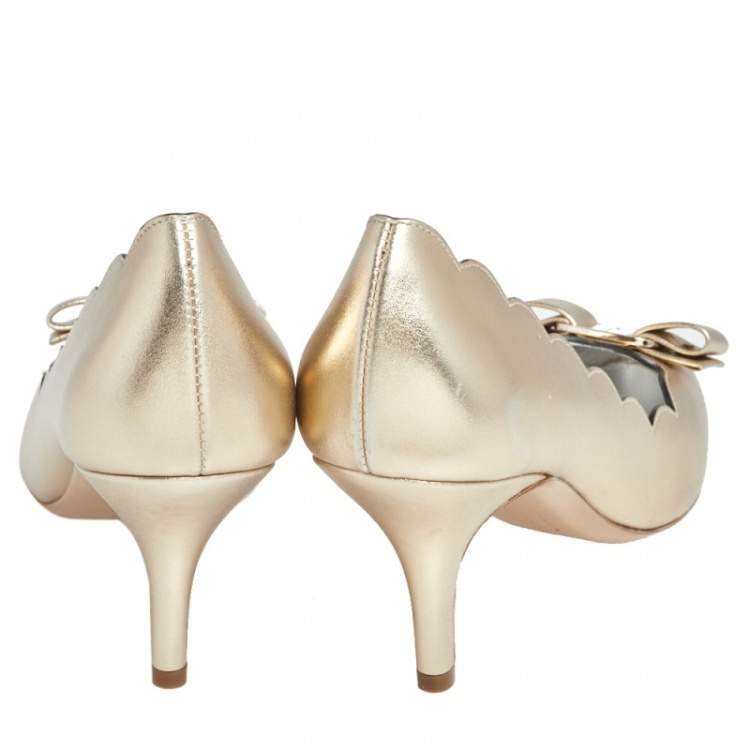 Pre Owned Salvatore Ferragamo Gold Leather Carla Vara Bow Pump Size 37