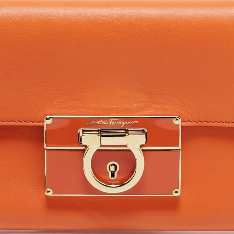 Pre Owned Salvatore Ferragamo Orange Leather Afef Lock Story Wristlet Clutch
