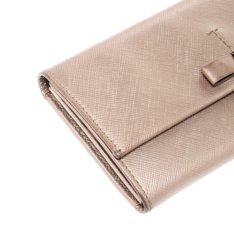 Pre Owned Salvatore Ferragamo Beige Metallic Leather Bow Continental Wallet