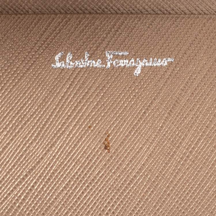 Pre Owned Salvatore Ferragamo Gold Leather Double Gancio Flap Compact Wallet