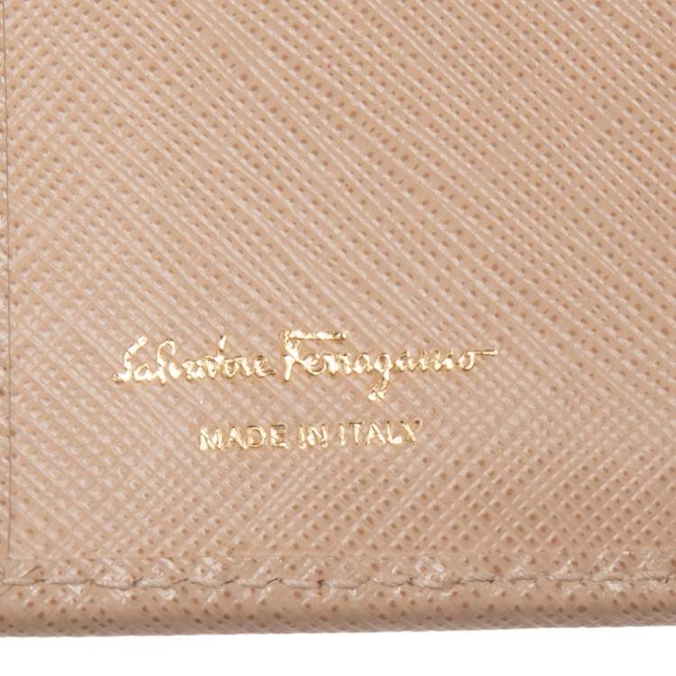 Pre Owned Salvatore Ferragamo Beige Leather Gancini Clip Compact Wallet