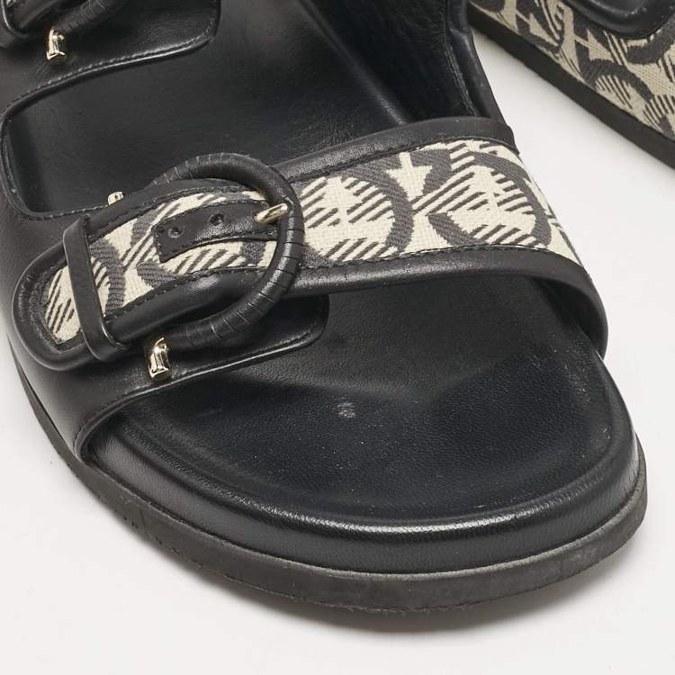 Pre Owned Salvatore Ferragamo Black/Off White Logo Print Fabric and Leather Gairo T Flat Slides Size 39.5