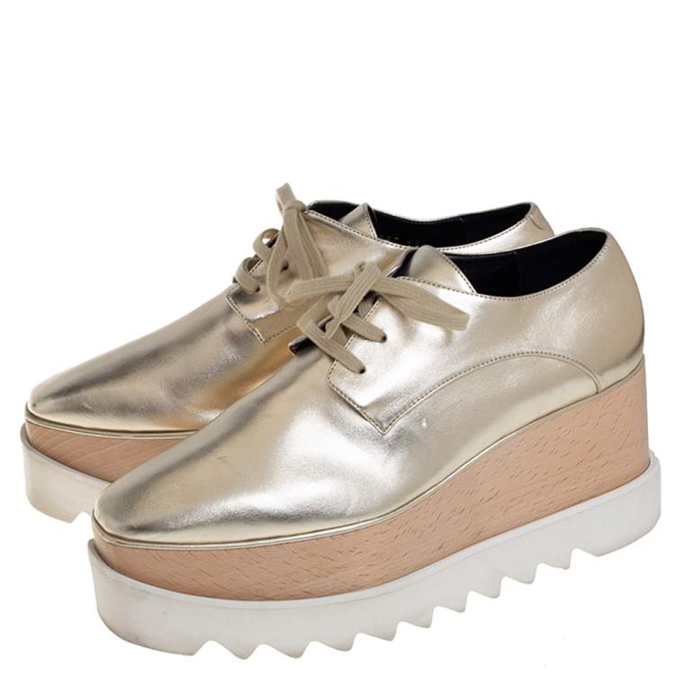 Pre Owned Stella McCartney Gold Faux Leather Wedge Sneakers Size 38.5