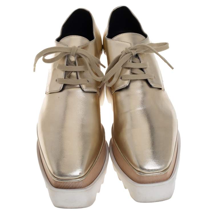 Pre Owned Stella McCartney Gold Faux Leather Wedge Sneakers Size 38.5