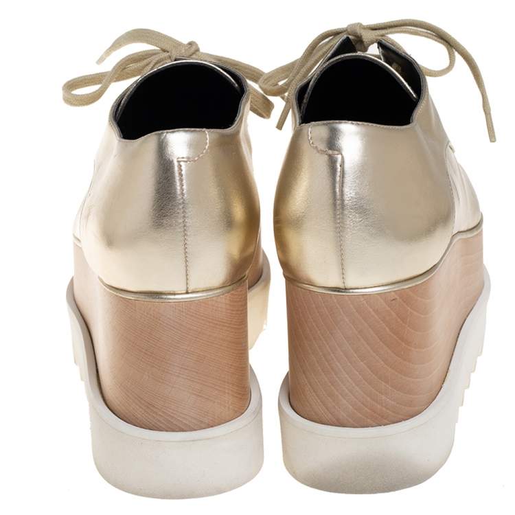 Pre Owned Stella McCartney Gold Faux Leather Wedge Sneakers Size 38.5