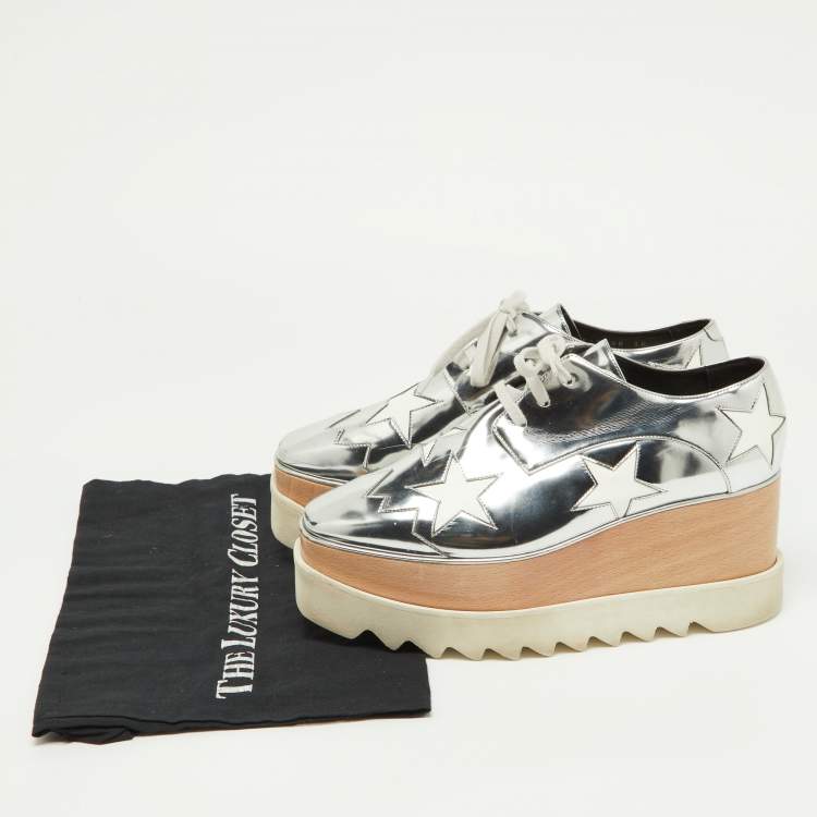 Pre Owned Stella McCartney Silver/White Faux Patent And Faux Leather Elyse Star Platform Lace Up Sneakers Size 38