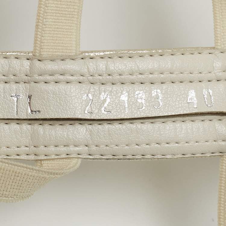 Pre Owned Stuart Weitzman Metallic White Leather and Elastic Gladiator Flat Sandals Size 40