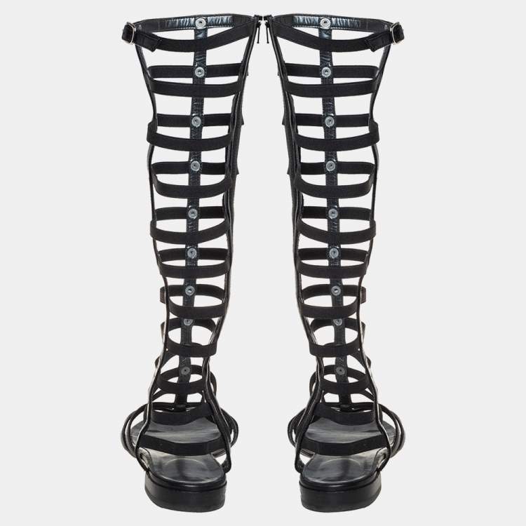 Pre Owned Stuart Weitzman Black Leather and Elastic Gladiator Flat Sandals Size 37.5