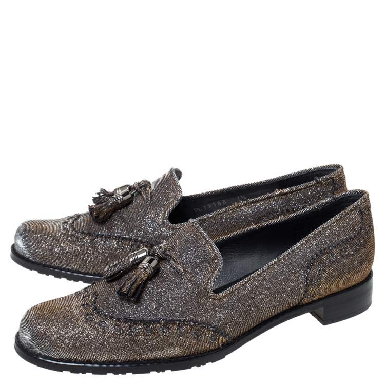 Pre Owned Stuart Weitzman For Russell & Bromley Black/Gold Lamé Fabric Tassel Detail Slip On Loafers Size 38