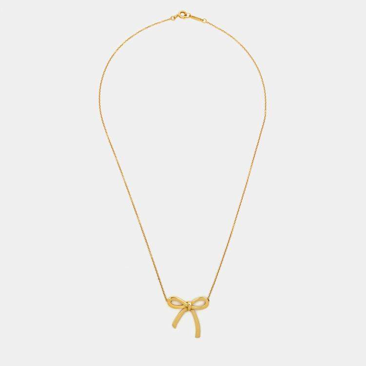 Tiffany gold bow on sale necklace