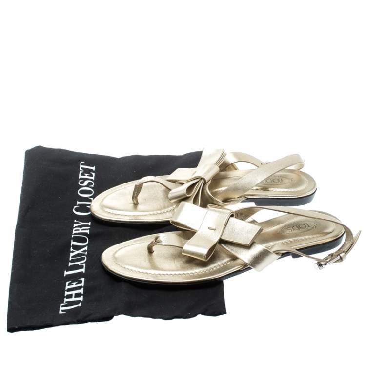 Pre Owned Tod's Metallic Gold Leather Bow Detail Flat Thong Sandals Size 37.5