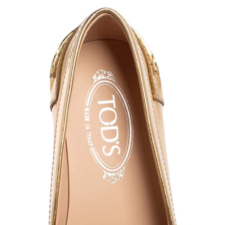 مملوكة مسبقًا Tod's Gold Glossy Leather Penny Loafers Size 39