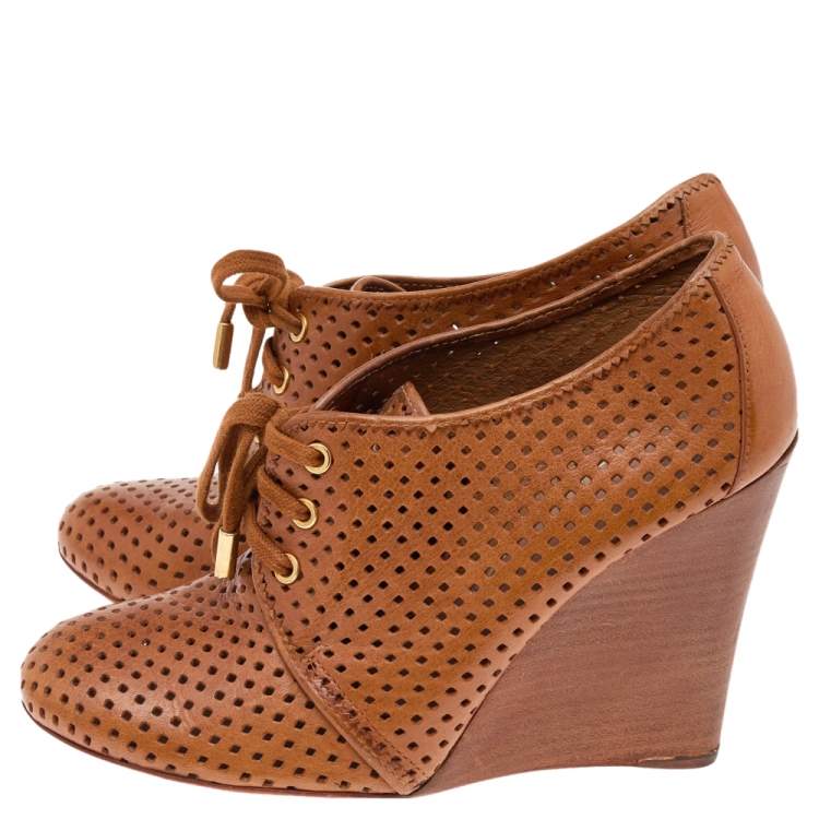 Pre Owned Tory Burch Brown Perforated Leather Wedge Sneakers Size 38.5