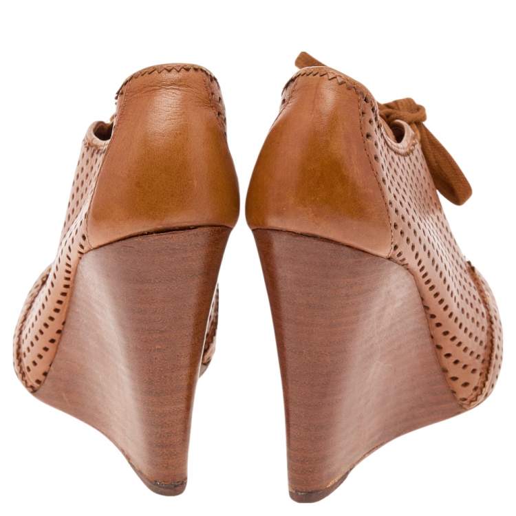 Pre Owned Tory Burch Brown Perforated Leather Wedge Sneakers Size 38.5