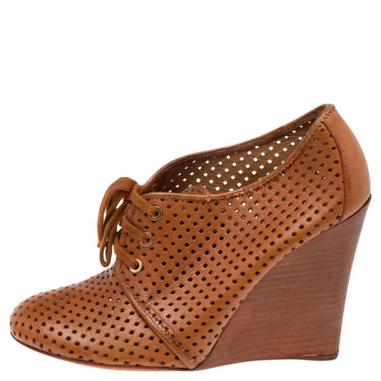 Pre Owned Tory Burch Brown Perforated Leather Wedge Sneakers Size 38.5