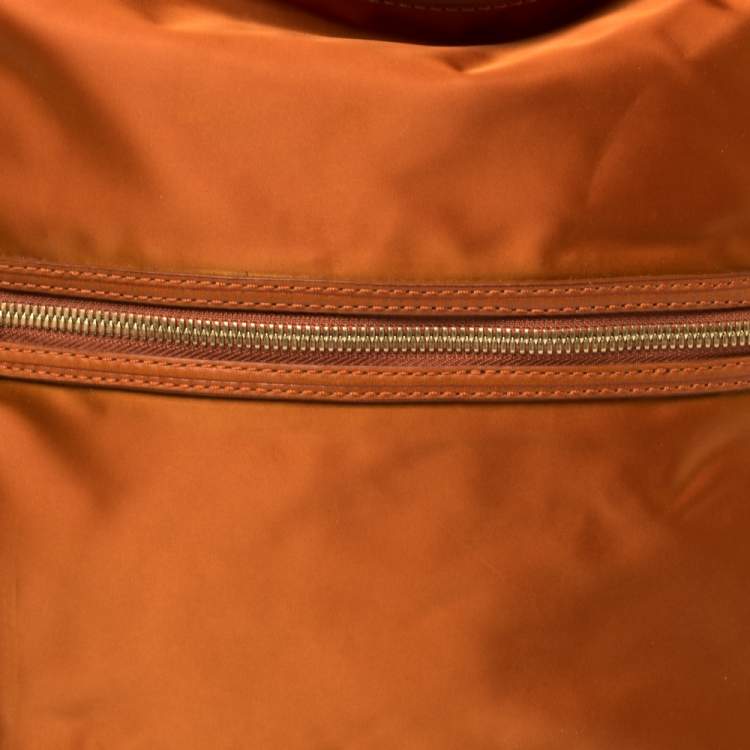 Pre Owned Tumi Orange Nylon Ashley Hobo