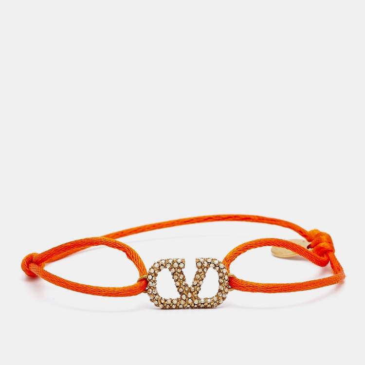 Pre Owned Valentino Vlogo Crystal Gold Tone Orange Cord Bracelet