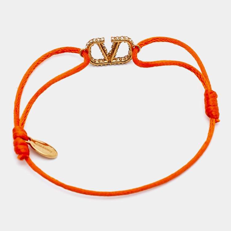 Pre Owned Valentino Vlogo Crystal Gold Tone Orange Cord Bracelet