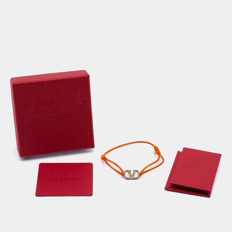 Pre Owned Valentino Vlogo Crystal Gold Tone Orange Cord Bracelet