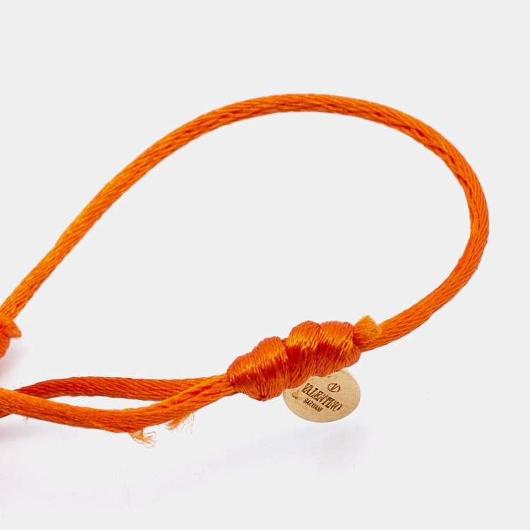 Pre Owned Valentino Vlogo Crystal Gold Tone Orange Cord Bracelet