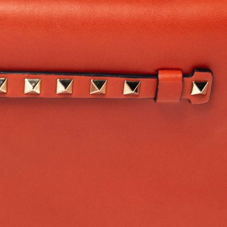 Pre Owned Valentino Orange Leather Rockstud Wristlet Clutch