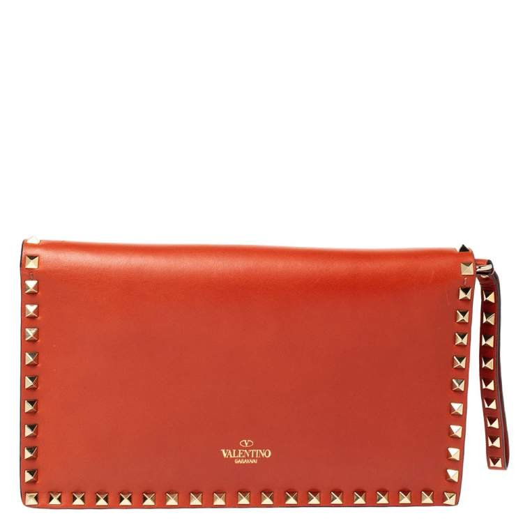 Pre Owned Valentino Orange Leather Rockstud Wristlet Clutch