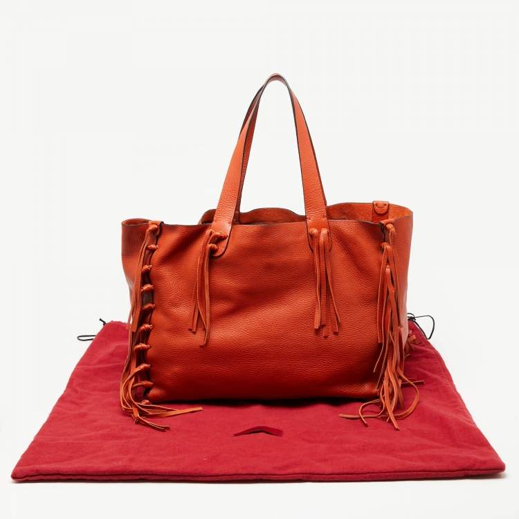 Pre Owned Valentino Orange Pebbled Leather Fringe C-Rockee Tote