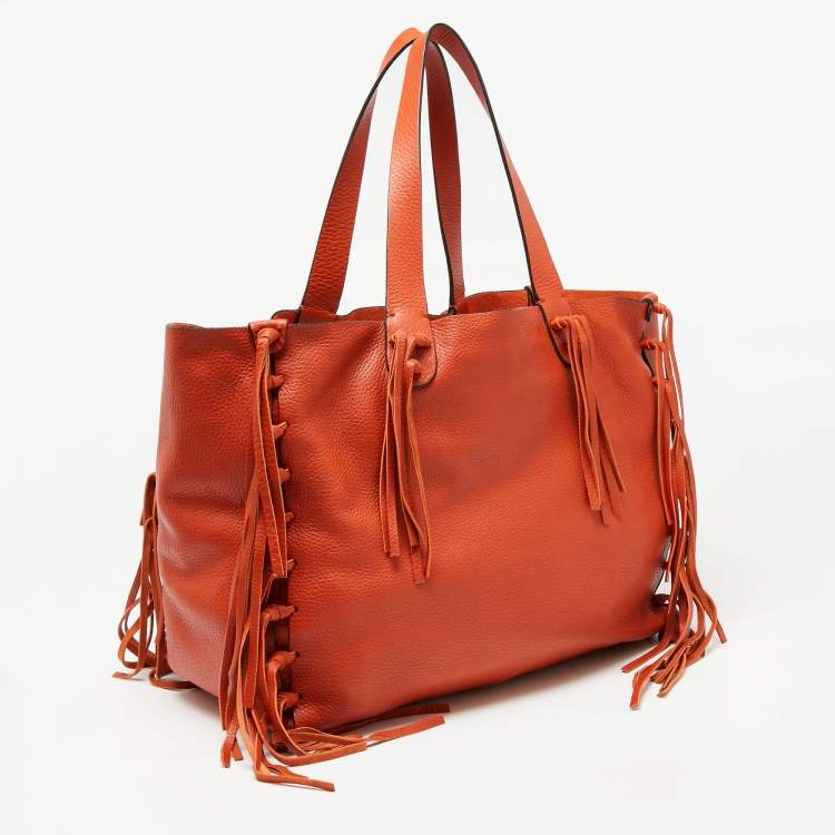 Pre Owned Valentino Orange Pebbled Leather Fringe C-Rockee Tote