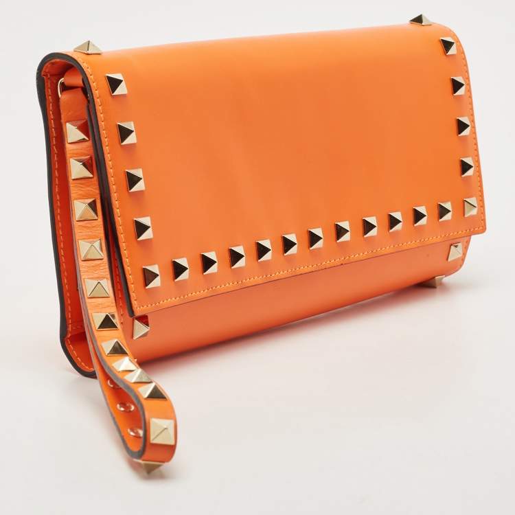 Pre Owned Valentino Neon Orange Leather Rockstud Trifold Wristlet Clutch